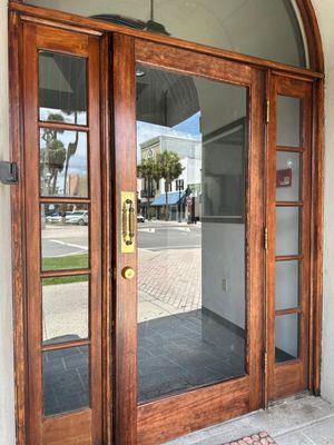 Brass high-security deadbolt installed with restricted Mul-T-Lock keyway.