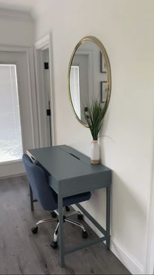 Mirror, desk, dark wood flooring