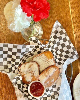 @feisty.eats beignets and strawberry jam