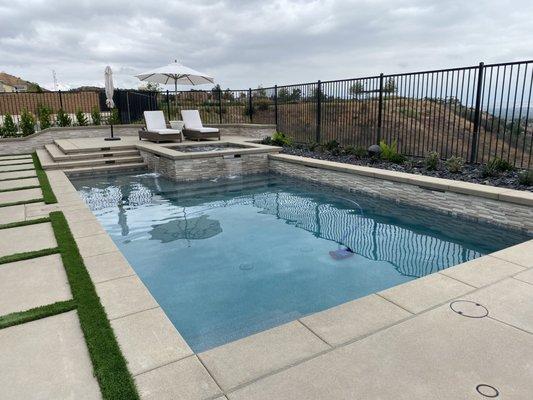 Our Pool , raised deck with Tahoe Blue Mini pebble . Salt . Love it!