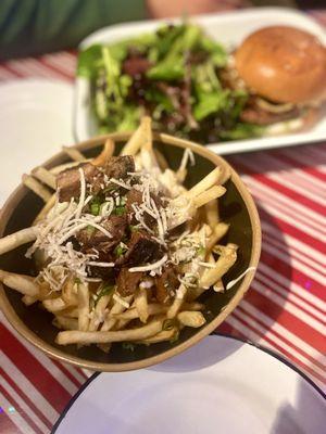 Smoked Brisket Poutine in the front. Beyond Veggie Burger with side salad in the back.