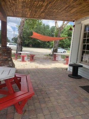 Sun sail and picnic tables for outdoor dining