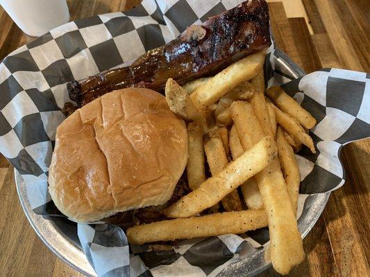 Pulled pork sandwich, rib, and fries