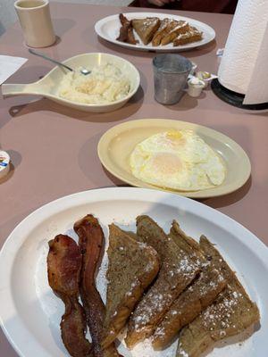 Breakfast-French toast w/bacon. Added eggs, hubby added grits. 12.2.23