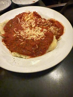 Portobello mushroom ravioli with red sauce over angel hair pasta