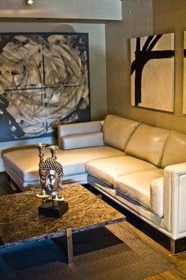 Moroni Grey Leather Sectional with Grey Natural Stone Coffee Table with Buddha Head