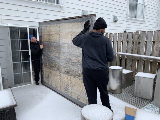 Billy and Shon moving a very large valuable piece of art. They took great care in moving this. Took their time and was very strategic.