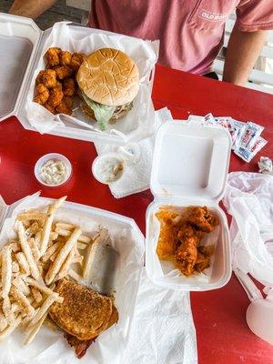 Cuban sandwich with garlic Parmesan cheese and a chicken sandwich with Cajun tots.