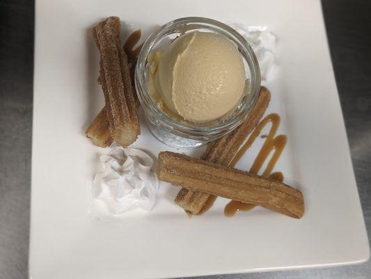 After dinner a nice hot churro served with vanilla ice cream