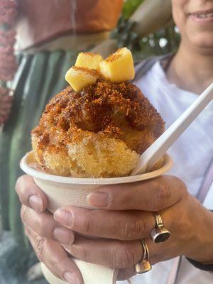 Say aloha to our Mangonada Shave Ice, made with mango whip, mango sorbet, mango nectar, shave ice, chamoy, and tajín. So good!