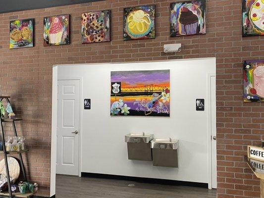 Restrooms and artwork on the walls