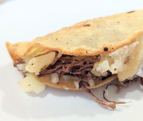 Shredded beef and potato taco