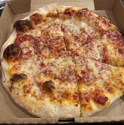 This is a cheese pizza except there's cheese missing on a fair portion of it. Looks like salt bae threw a dusting on and called it good.