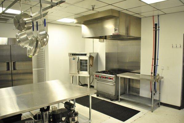 Spindle Kitchen, view of convection oven, range and prep areas