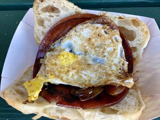 Bologna, egg, and sautéed onions on a salty roll.