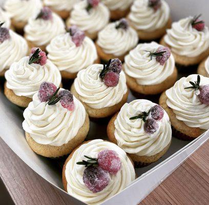 Vanilla cupcake, cranberry cream cheese filling,white chocolate buttercream, crystalized cranberries, rosemary.