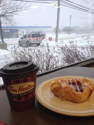 Small chai latte with a cherry cheese danish