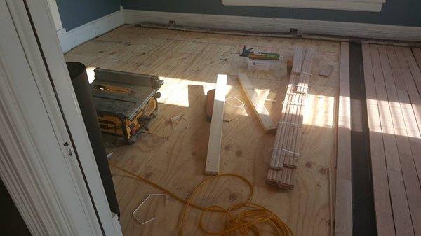 Once base floor is installed, now we start to rack out the oak flooring. Image 3