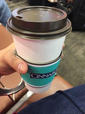 Sipping on a large coffee while I wait for my flight.  It's strong and flavorless even after cream and sugar.