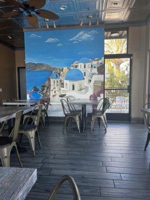 Dining area with a beautiful mural.