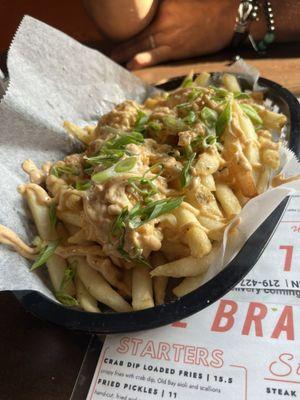 Fries topped with old bay aioli