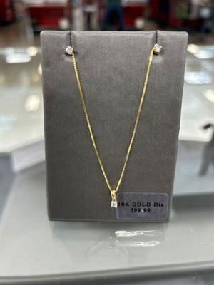 Gold Diamond Solitaire pendant and Earrings.