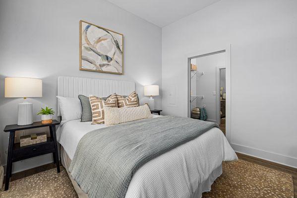 bedroom with large window and spacious closet