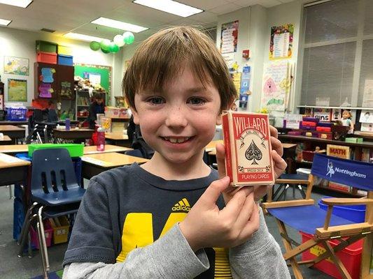 This kid LOVES his new deck of cards from Portland Magic Academy