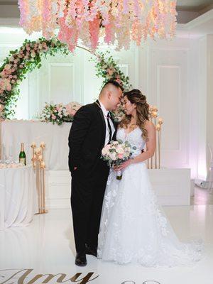 Floral arch and chandelier from Thai Bridal