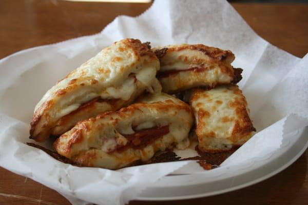 OUR ONE OF A  KIND STUFFED BREAD STICKS: THESE ARE STUFFED WITH CHEESE & PEPPERONI.