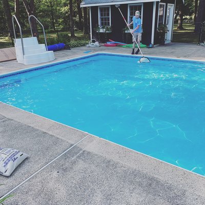 Josh our great young service tech netting a pool while we install some new pool stairs in Hamilton MA