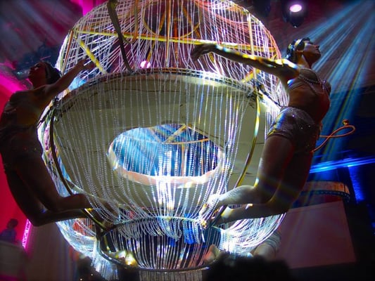 Four aerialist on the massive chandelier! Lucky people actually get to be taken up in it.