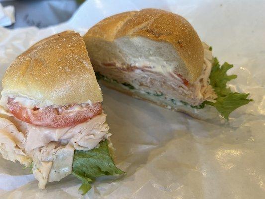 Roasted chicken on a roll w/lettuce, tomato and mayo