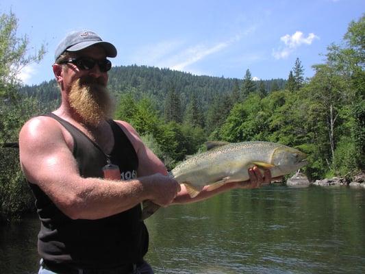 Randy Doughty Owner of Tightline Connection on the Trinity River with a Silver Coho Salmon