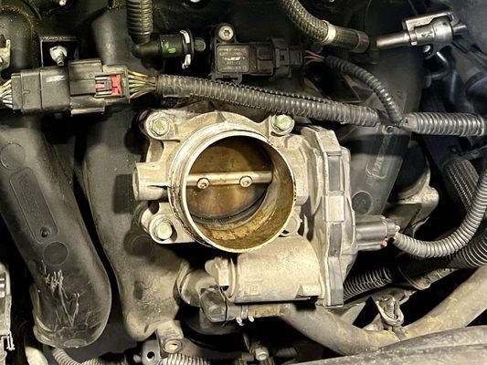 When the head crack was fixed the throttle body should've been cleaned and clearly wasn't.