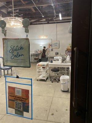 View through the window of creative sewing space for teaching and rent