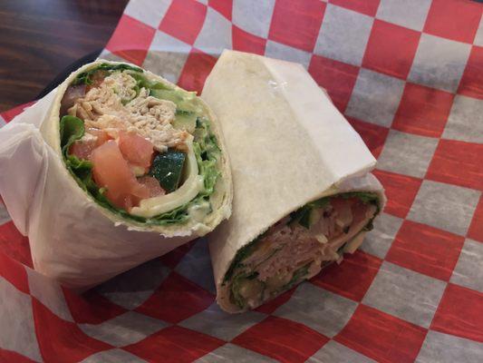 Tim's favorite wrap with turkey, cheese, onion,  lettuce, cucumber, tomato and garlic basil mayo.