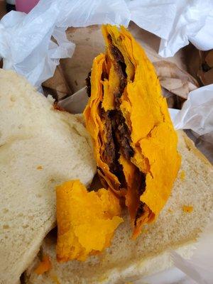 This dried up and hard beef patty with cocobread is what they sold me thru Grubhub last night