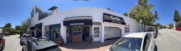 Pano of street outside shoe repair