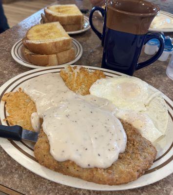 Chicken Fried Steak, eggs, hash browns and homemade toast.