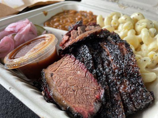 Brisket BBQ box with mac & cheese, smoked baked beans and house made pickles.