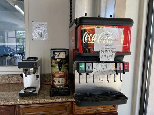 Out of order soda and tea. Empty free coffee area.