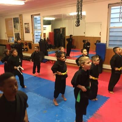 Kids learning discipline, respect, focus. All through hard work and dedication. Teaching basic values.