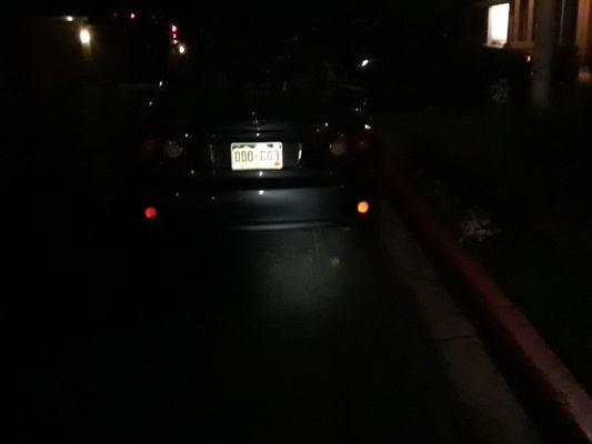 The Maxx Auto Recovery vehicle ironically parked in a fire lane, with a "tow away zone" sign only a few feet away.