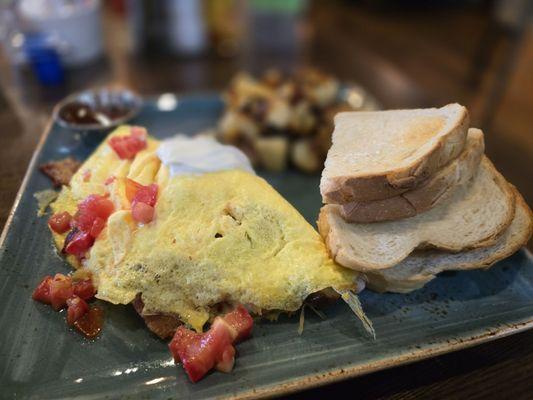 The Works Omelet with home fires and sour dough