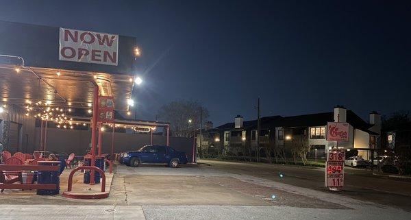 A lovely patio with the gas price sign.