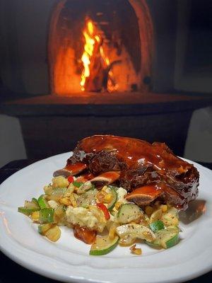 Local Buffalo short ribs in chipotle bbq sauce, mashed potatoes, & seasonal Ojo farm veggies.