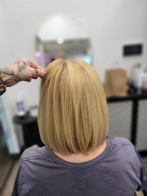 Blonde color and long bob.