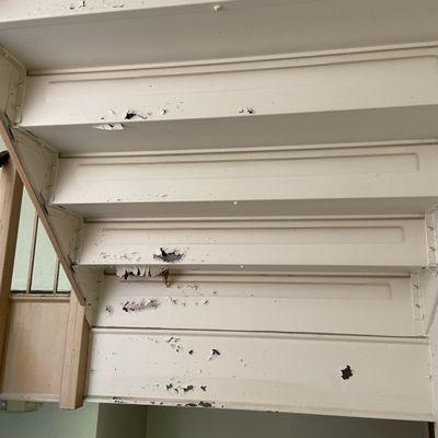 Chipping paint under stairwells