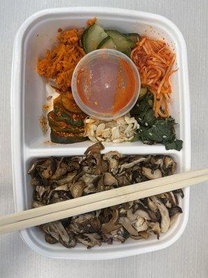 Vegan Bibimbap: black rice underneath mushrooms.  flavor bombs. Love this. 6.8.22.